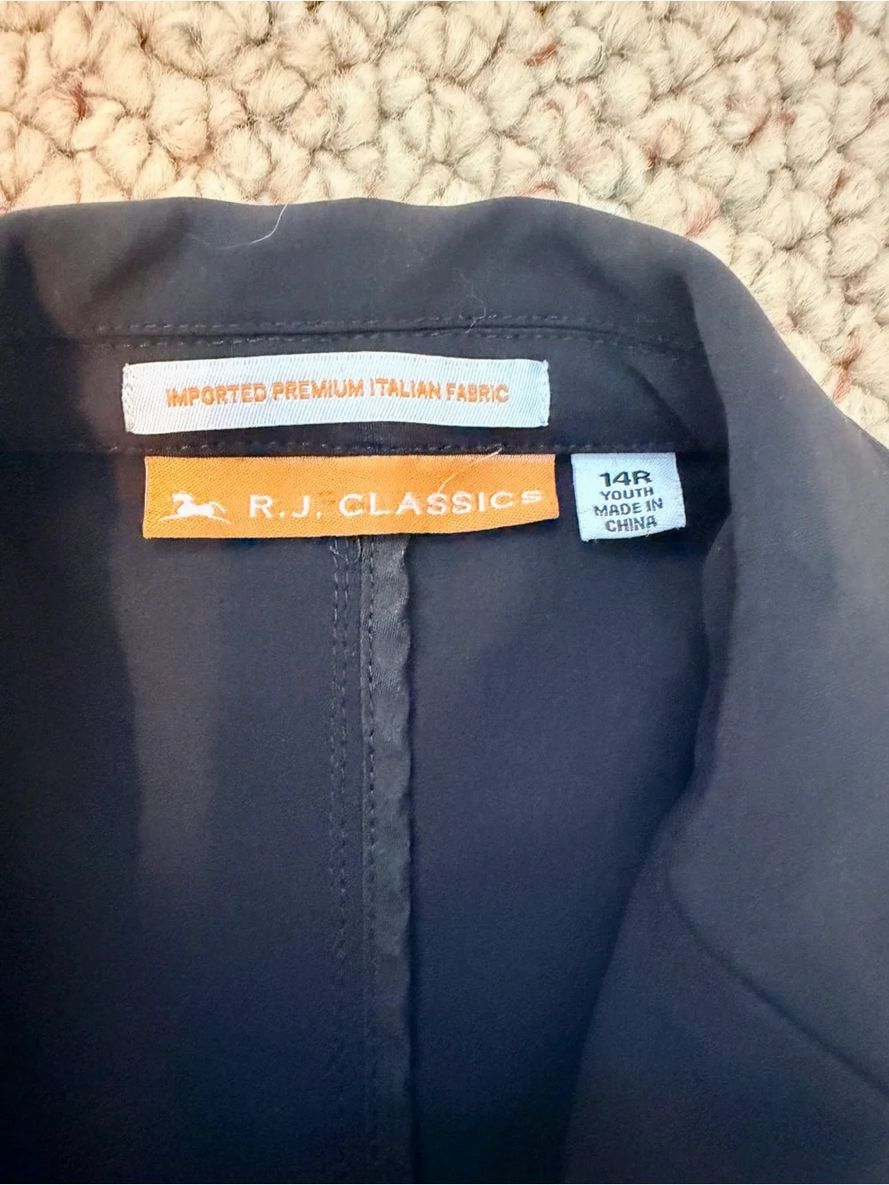 RJ Classics Black Orange Label Kids Show Jacket with white cuffs.